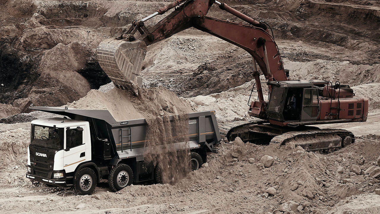 excavator loading a tipper
