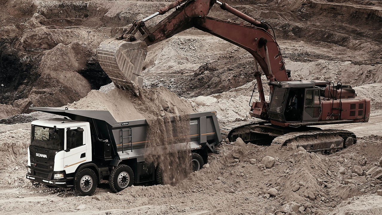 excavator loading a tipper