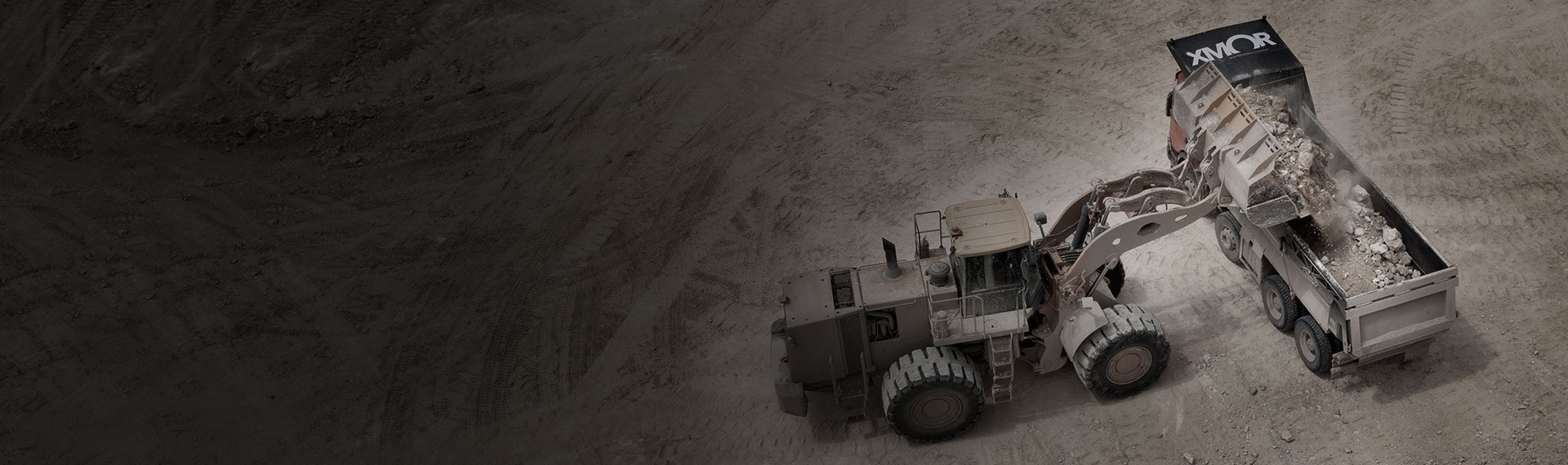 excavator loading a tipper